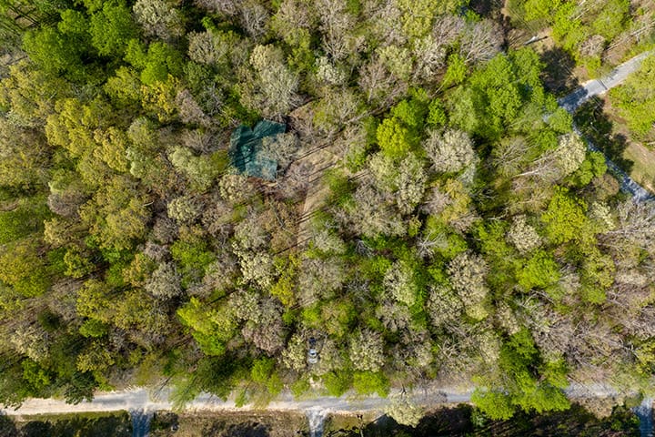 An aerial view of a wooded area.