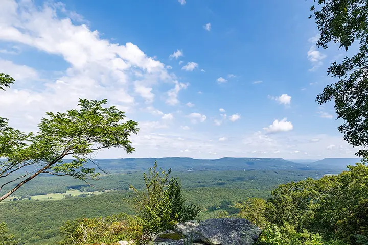 A view of the blue ridge mountains from the top of a hill.