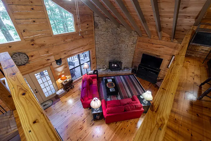 An aerial view of a living room in a log cabin.