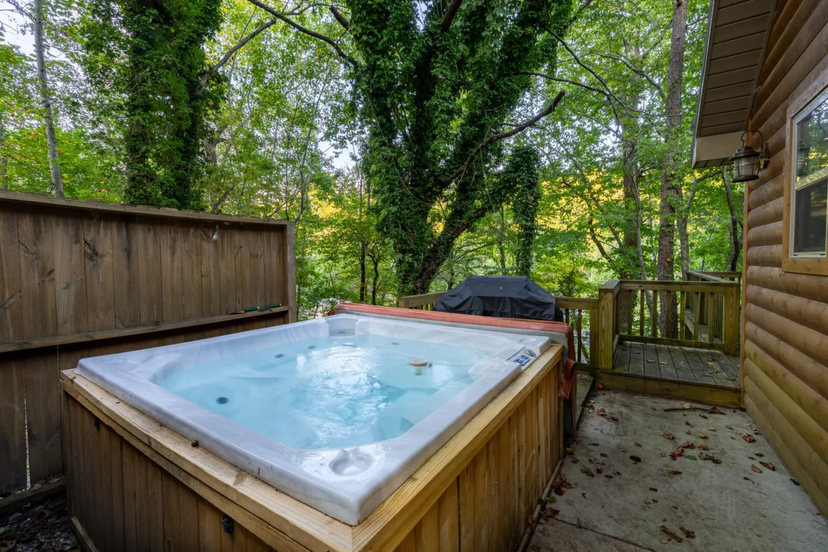 A hot tub on the deck of a cabin in pigeon forge, tennessee.