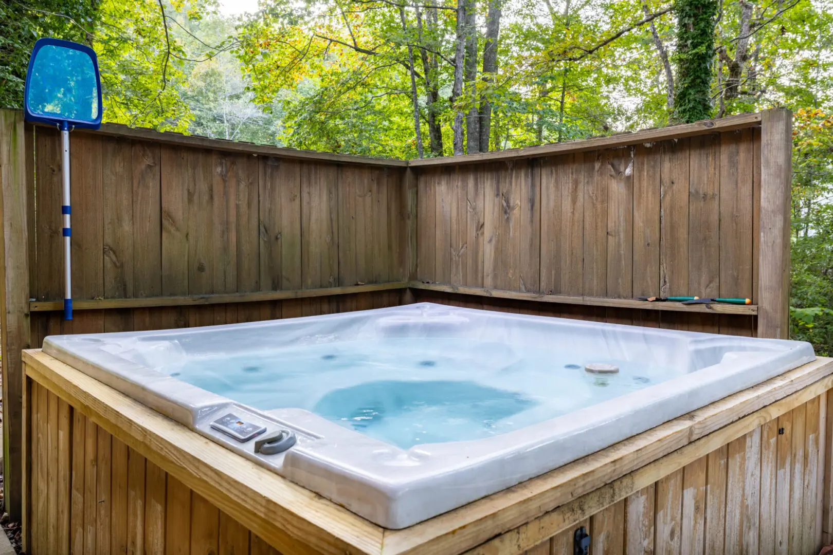 A hot tub in a wooded area.