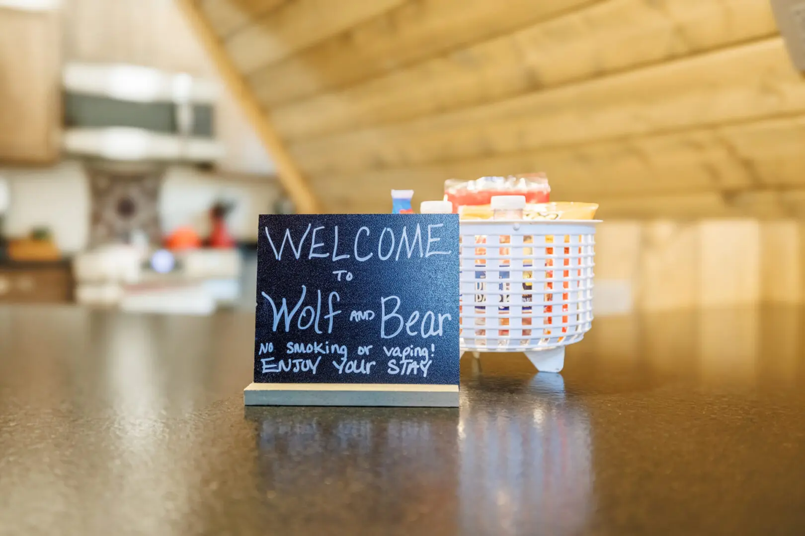 A welcome sign sits on a counter in a Little River Point kitchen.