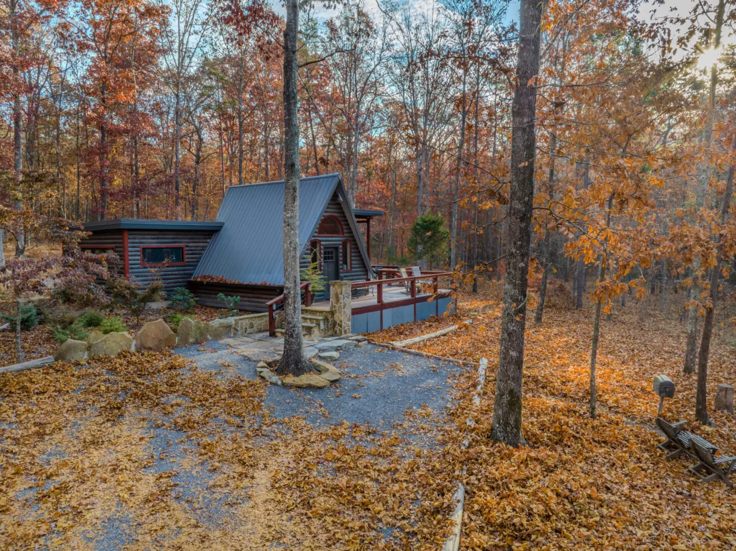 An aerial view of Little River Point cabin nestled in the woods.